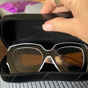 Black and white glasses with iconic white logo with Black Quilted Glasses Case